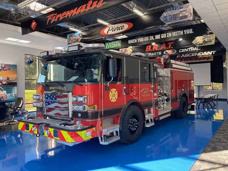 Pumper front-left exterior view showing grille, bumper, and side body