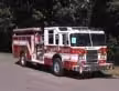 Wide front-left thumbnail view of the pumper parked roadside with full side body visible.