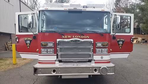 Head-on front view showing grille and bumper intake from low angle