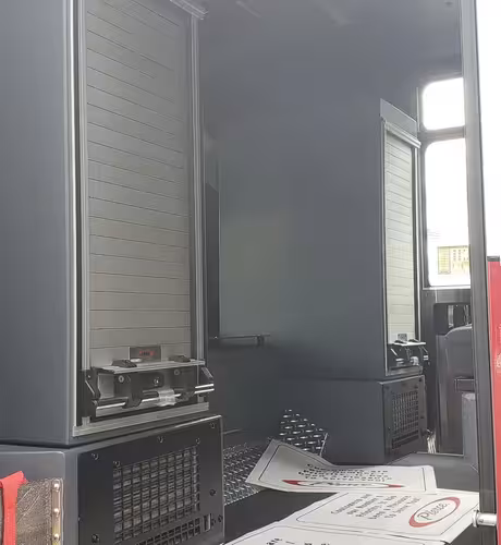 Open side compartment showing empty shelf bay and interior paneling