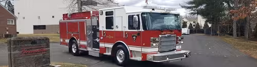 Pumper front-left exterior profile showing full side body