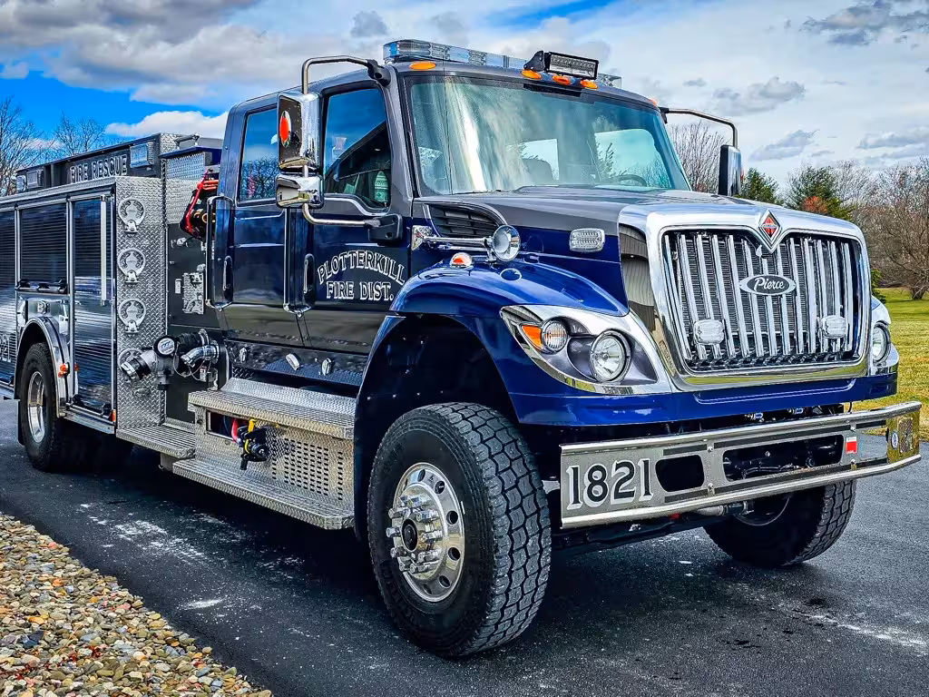 Rescue truck front-left exterior view showing blue cab and long body