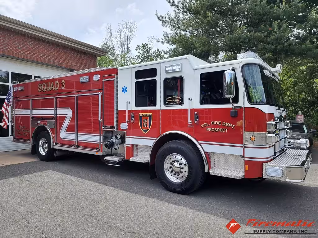 Rescue pumper front-left exterior view showing enclosed cab and long body