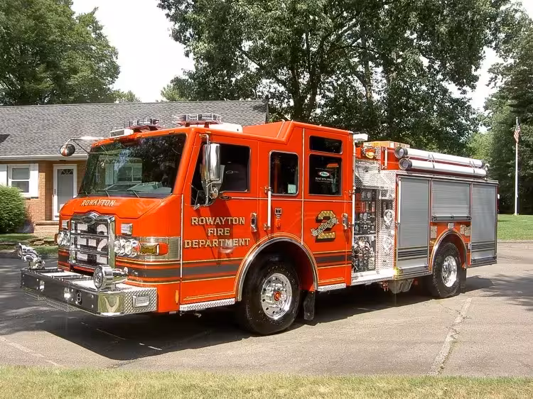 Pumper front-left exterior view showing enclosed cab and side compartments