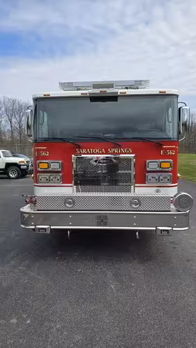 Pumper front view showing grille, bumper intake, and warning lights