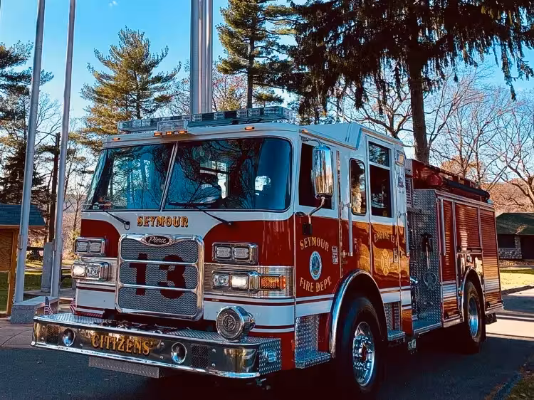 Pumper front-left exterior view showing enclosed cab and side body