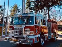 Pumper front-left exterior profile showing cab and side body