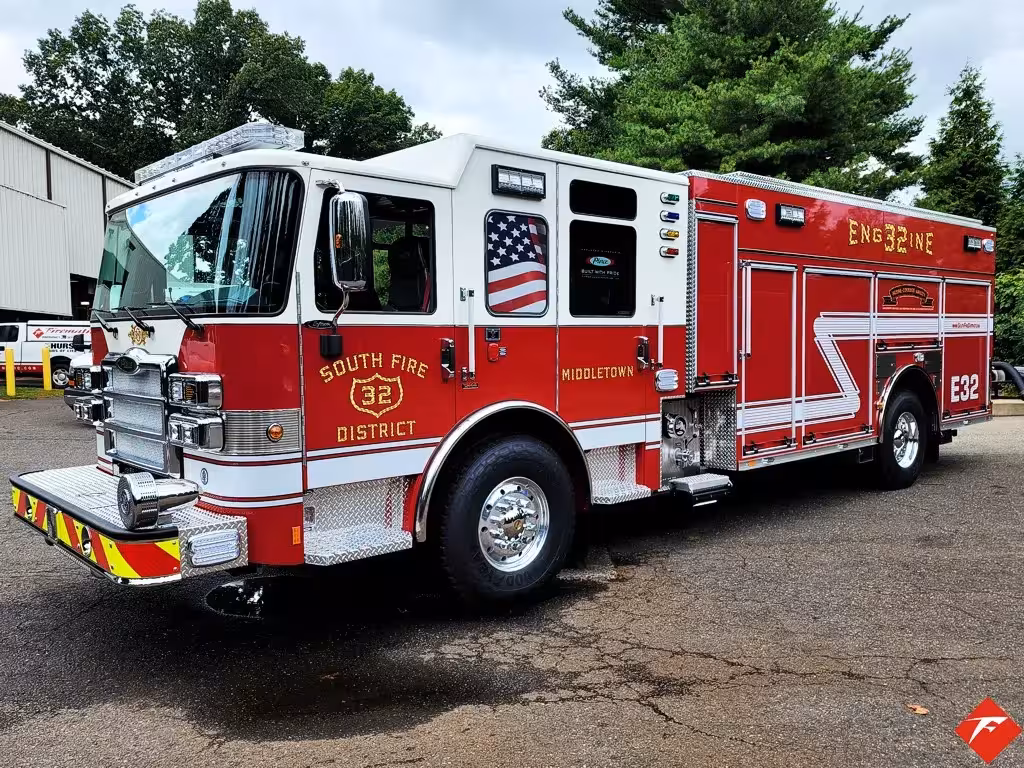Pumper front-left exterior view showing enclosed cab and side body