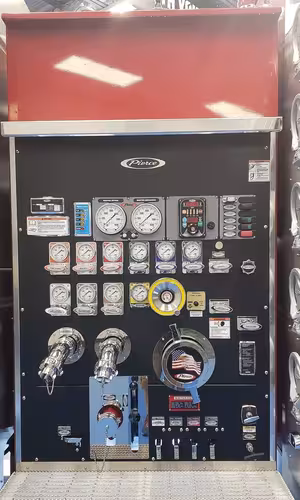 Pump panel close-up showing gauges, valves, and control levers