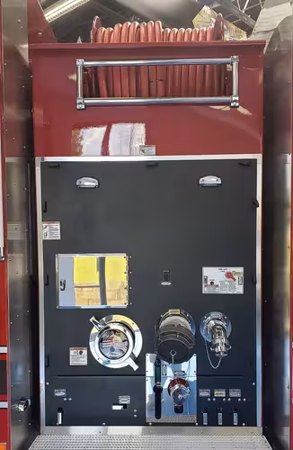 Rear control panel close-up showing gauges, valves, and hose connections