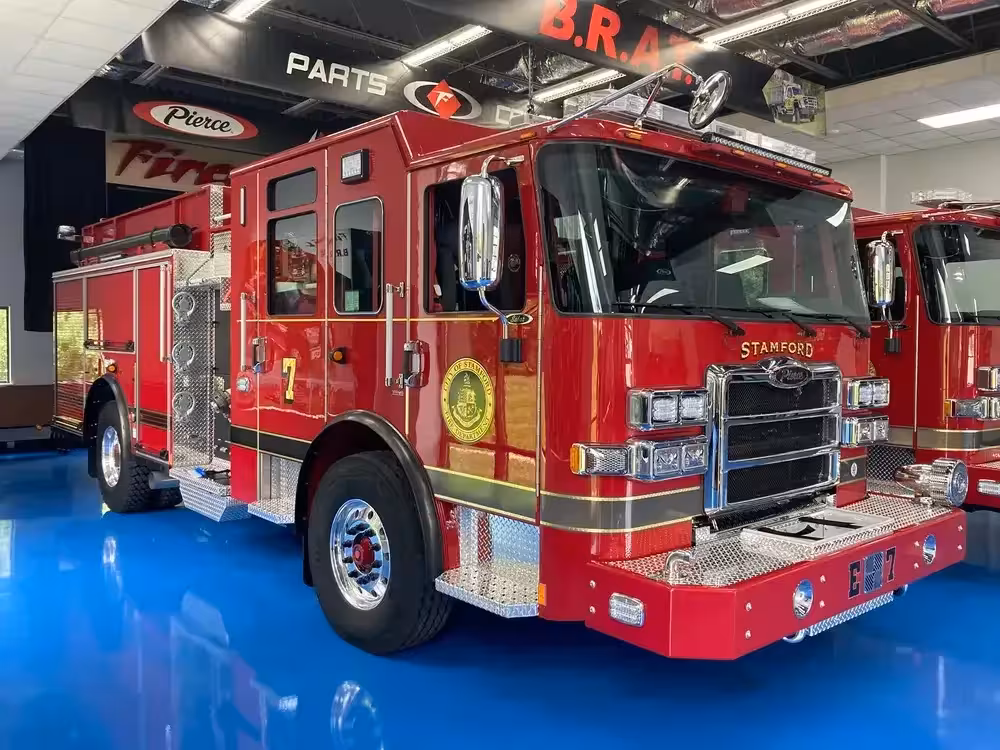Pumper front-left exterior view showing grille, bumper, and side body