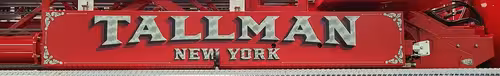 Body side lettering close-up strip showing Tallman New York script