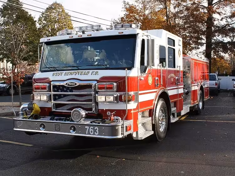 Pumper front-left exterior view showing cab, grille, and side body