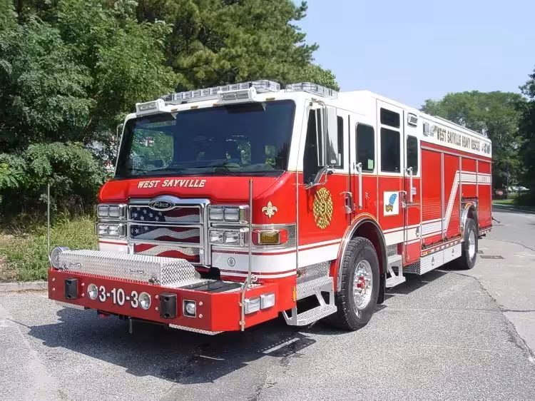 Front-left exterior view of a heavy rescue truck showing the enclosed cab, side compartments, and rear body.