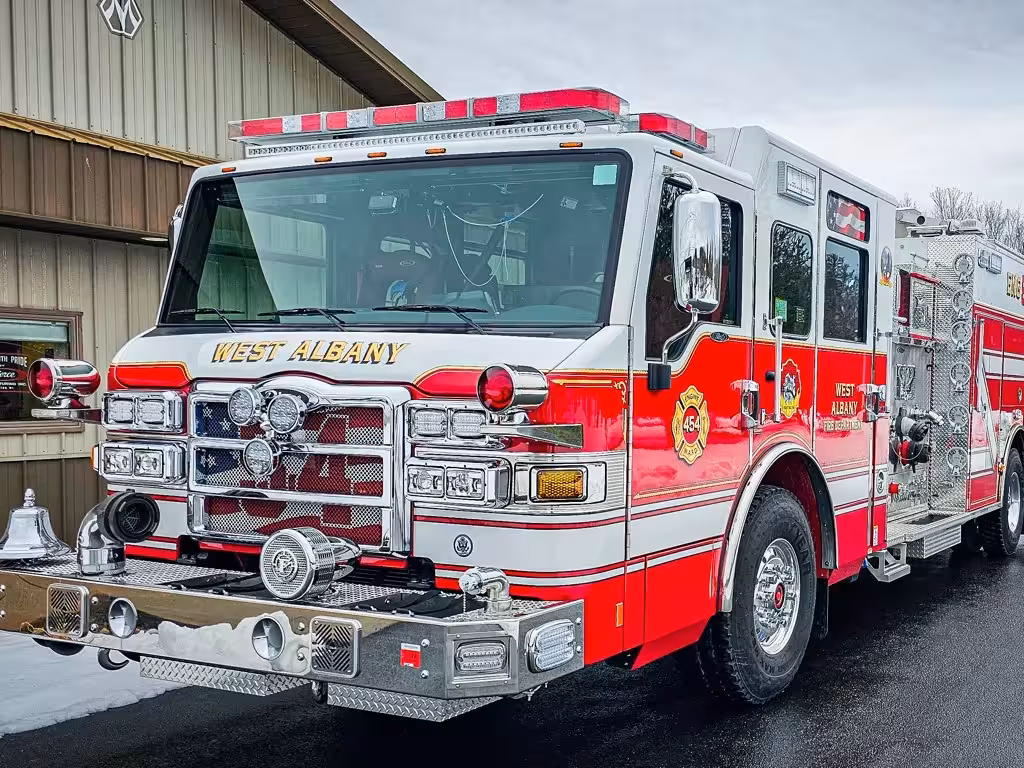 Pumper front-left exterior view showing grille, bumper, and side body