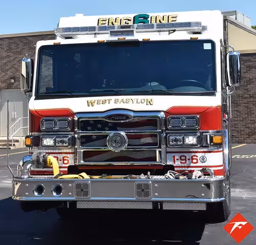 Front exterior view showing grille, bumper, and warning lights