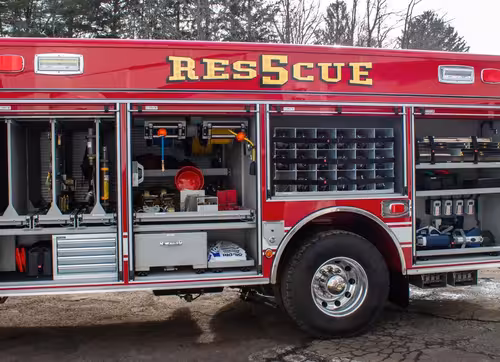 Weston Pierce heavy rescue full driver-side exterior view parked in front of the firehouse