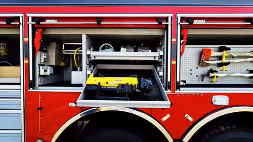 Open side compartment showing generator unit and tool storage