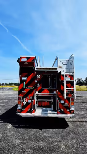 Rear view showing chevrons, rear lights, and open center compartment