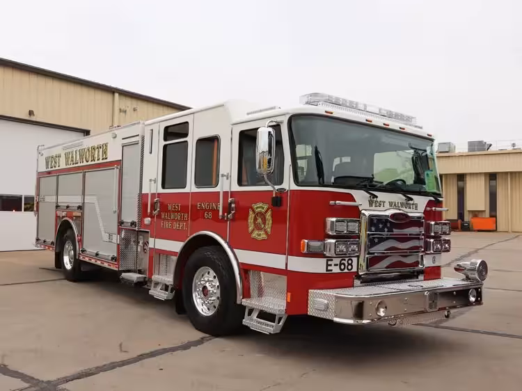 Pumper front-left exterior view showing grille, bumper, and crew cab