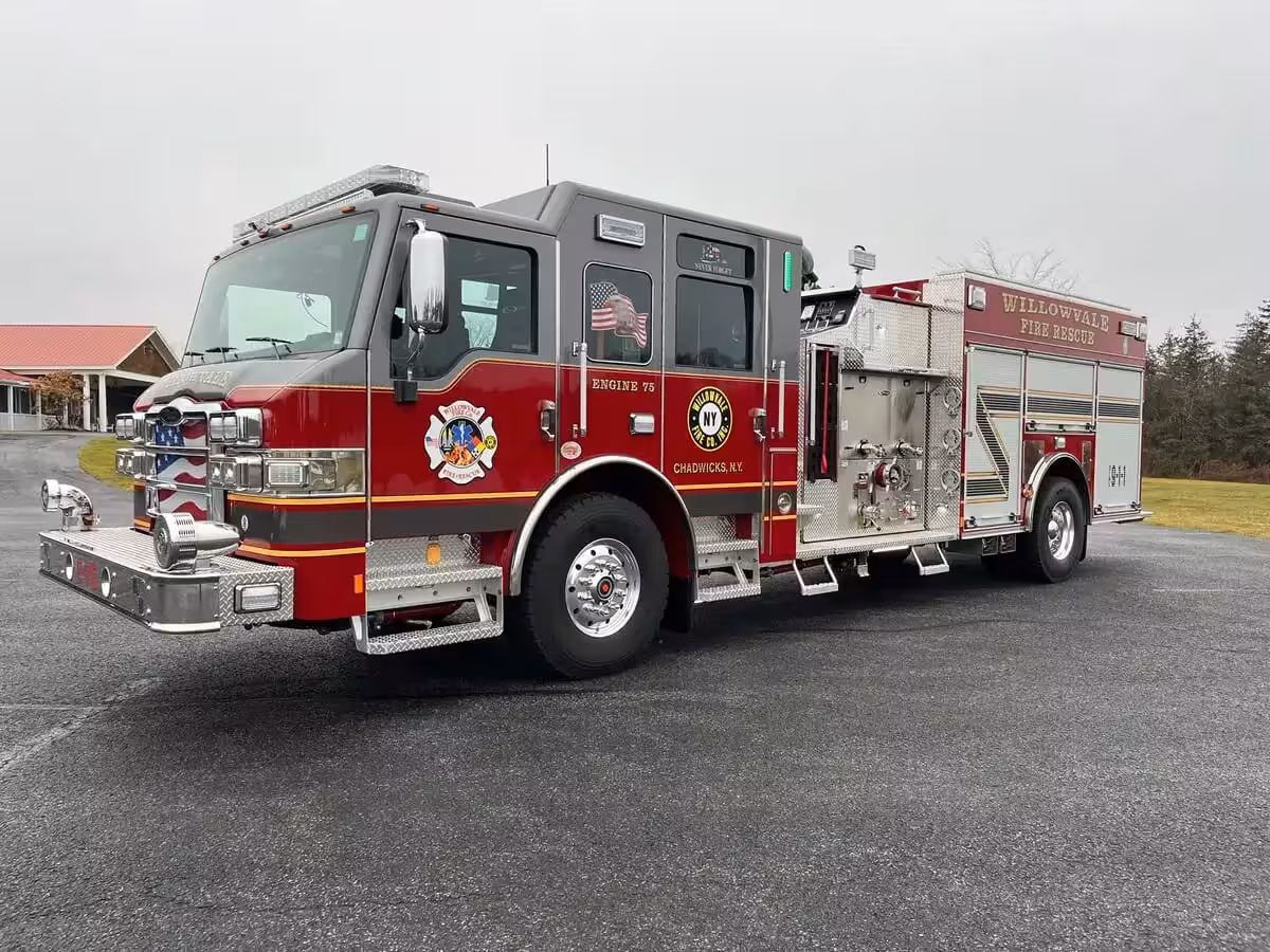 Pumper front-right exterior view showing side pump panel and crew cab