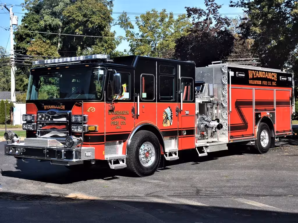 Pumper front-left exterior view showing black cab top and side body