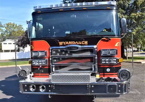 Head-on front view showing grille and bumper intake from right angle