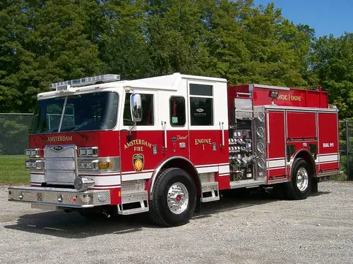 Pumper front-left exterior view showing cab, grille, and side compartments