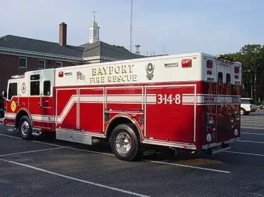 Rear right angle showing side compartment doors, rear lights, and wheel/tire area.