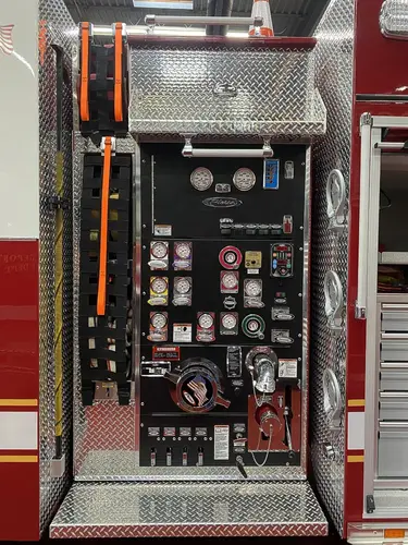 Pump-side control panel close-up showing gauges, valves, and intake controls
