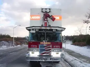 Head-on front view showing grille and elevated bucket platform