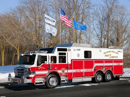 Bellmore heavy rescue truck driver-side profile with long rescue body and tandem rear axles