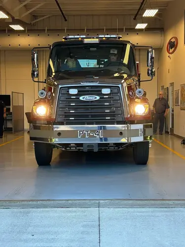 Front exterior view in station bay showing grille, bumper, and warning lights
