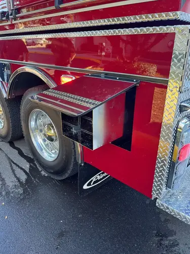Lower rear wheel area close-up showing rear step and fender