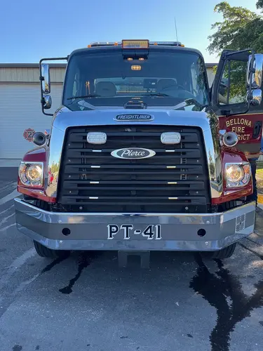 Front exterior close view showing grille, bumper, and headlights