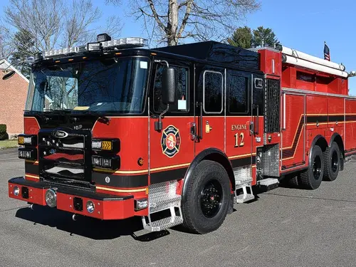 Pumper front-left exterior view showing dark cab top and side body