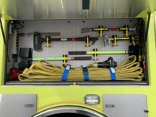 Beukendaal Pierce Enforcer pumper open side compartment with hose and hand tools