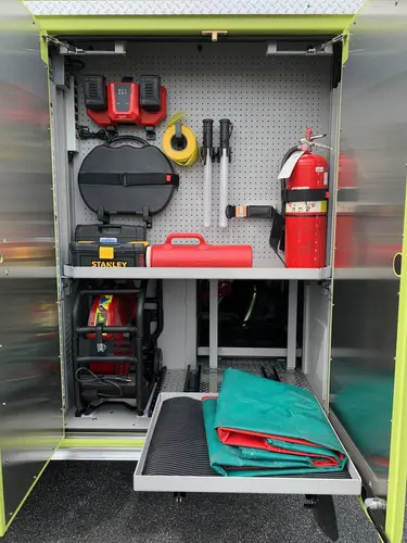 Beukendaal Pierce Enforcer pumper open side compartment with extinguishers and tool storage