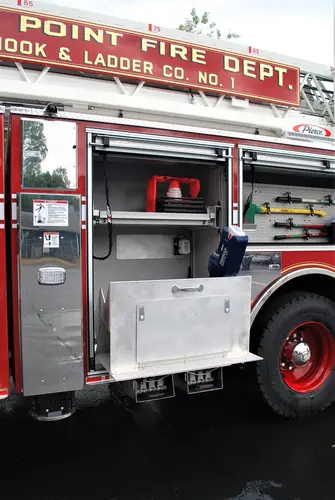 Driver-side profile with open side body panel and equipment bay