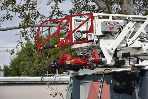 Ladder tip close-up showing red bucket framework and ladder sections