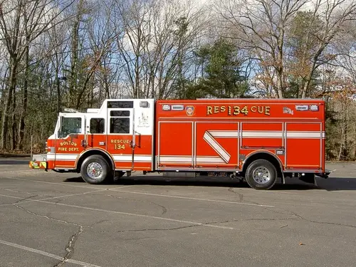 Passenger-side profile view showing long side compartments and wheel area