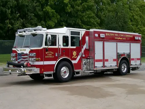 Pumper front-left exterior view showing enclosed cab and side compartments
