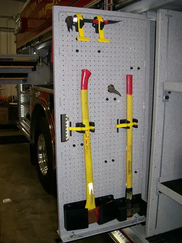 Open side compartment showing long-tool rack and mounted adapters