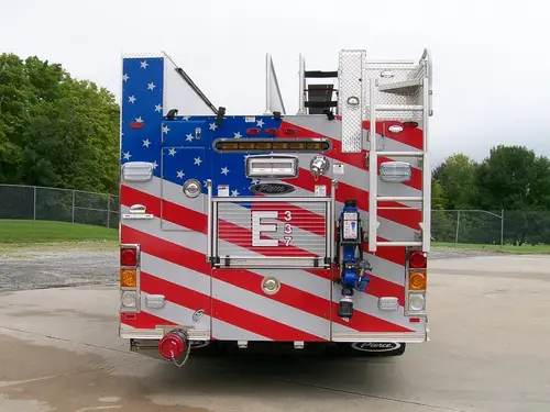 Rear body close-up showing American-flag style rear panel and mounted ladder