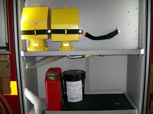 Open side compartment showing yellow storage cases and shelf space