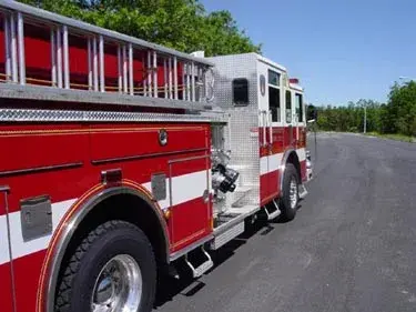 Driver-side detail view showing ladder rack and side body panel