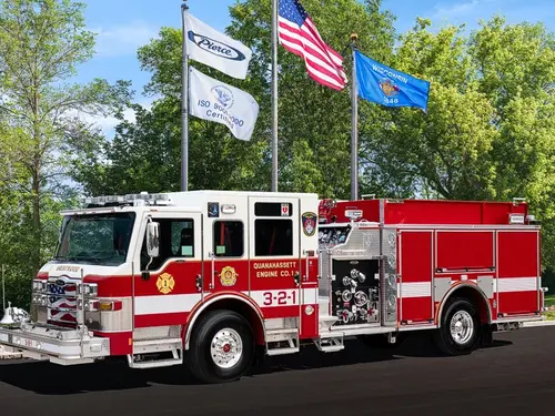 Pierce Dash pumper front-left exterior view with pump panel and side compartments
