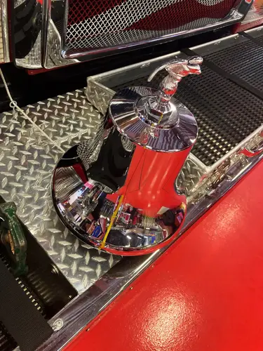 Pierce pumper front-left view inside bay showing grille and bumper