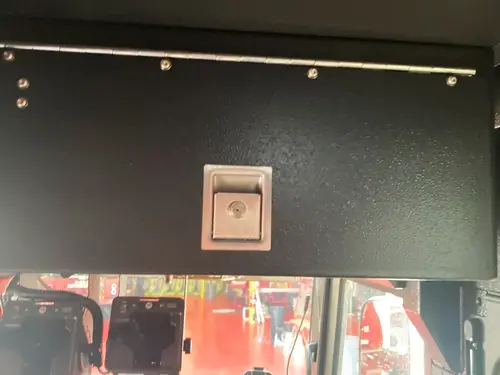 SCBA seatback close-up showing mounted breathing apparatus bracket