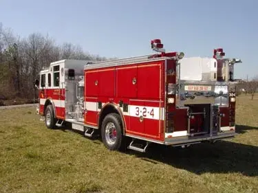 Rear-right exterior view showing rear body, hosebed area, and rear wheel